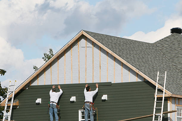 Professional Siding technician working in Brightwaters, NY